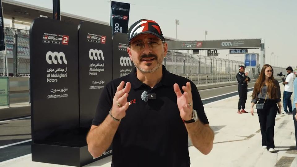 Presenter on the pit lane at an Al Abdulghani Motors track event