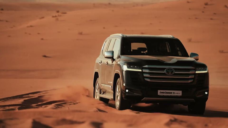 Toyota Land Cruiser 300 HEV cresting a dune in Wadi Rum
